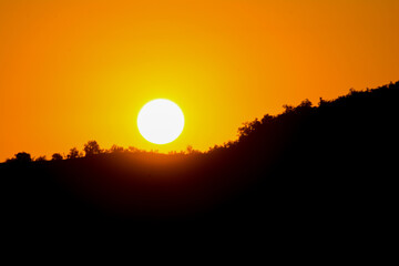 Golden sunrise over the mountain. Beautiful sunset