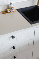 Empty Stone Kitchen Countertop In Modern Kitchen - stock photo - light/white quartz top and white cabinets