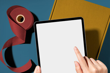 Tablet png mockup, transparent screen, online business concept, brown parcel box below