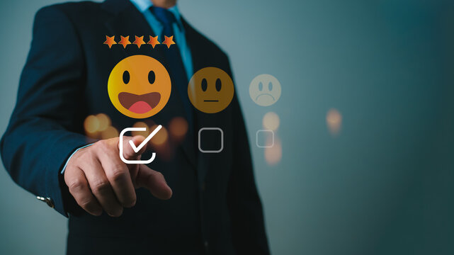 Businessman give excellent five-star ratings, Customer experience concept. Customers give excellent five-star ratings with smiley face emoticons for service, Satisfaction, Reviews, Feedback.