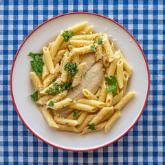 Penne pasta with cod fish and parmesan cheese.