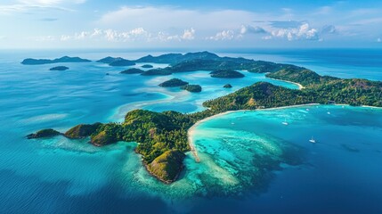 A stunning aerial view of a tropical archipelago with numerous small islands surrounded by crystal-clear turquoise waters.