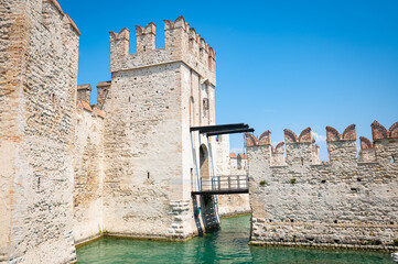 Picturesque view of Rocca Scaligera Castle with drawbridge in the historic town of Sirmione on the southern shore of Garda Lake, Italy
