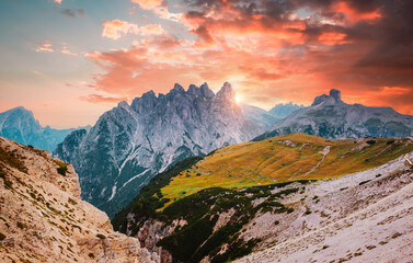 Mountainous terrain with a rocky massif in the Italian Alps in the early morning. South Tyrol,...