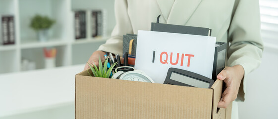 Stressful business women will resign from the company. He is lifting a brown paper box that holds...