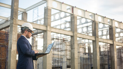 an architect engineer inspecting the building construction and check the progress of the construction plan, the foreman inspecting the building construction