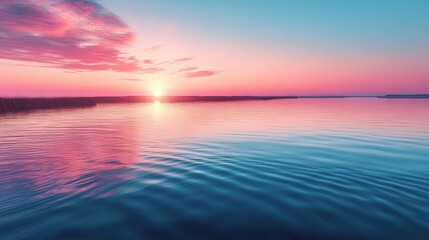 Fototapeta premium Pastel-colored sky at dawn over calm waters