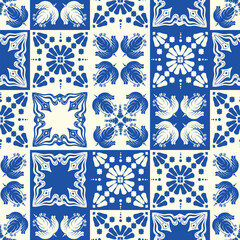 The blue and white seamless pattern displays symmetrical geometric designs. Ceramic tile abstract background