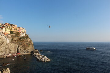 elicopter flies above. the sea