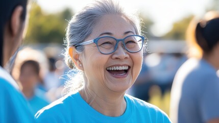 Fototapeta premium A joyful Asian retiree participates in a community volunteering event, connecting with others and sharing smiles on a sunny day