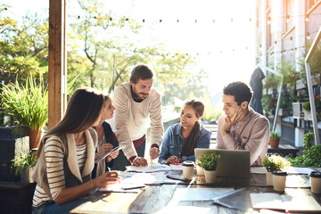Small business, people and paper at cafe for meeting, company finance and strategy for growth. Startup, team or discussion in coffee shop for collaboration, planning and man with feedback at laptop