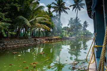 A beautiful, tropical scene cruising down the backwaters of Kerala in India