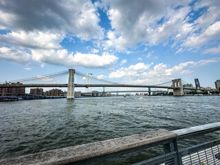 View of the Brooklyn Bridge and Manhattan Bridge side by side over the East River. New York City Manhattan Seaport angle 