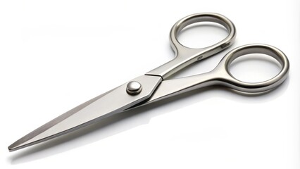 Fototapeta premium A pair of sharp, stainless steel scissors lies open on a clean, white background, waiting to cut through various materials with precision and ease.