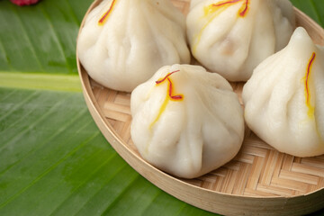 Steamed Modak, white modak, ukdiche modak made from rice flour and coconut jaggery filling. Modak is a traditional Indian sweet made during Ganesh Utsav