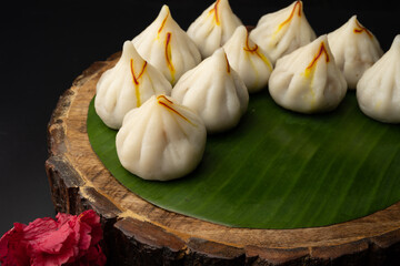 Steamed Modak, white modak, ukdiche modak made from rice flour and coconut jaggery filling. Modak is a traditional Indian sweet made during Ganesh Utsav