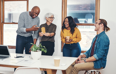 Fun, colleagues and mature woman with phone, laughing and happy with collaboration, creative and...