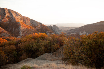 A beautiful view of the nature, mountain, full forest with orange leaves