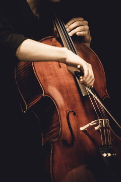 guy playing cello close up