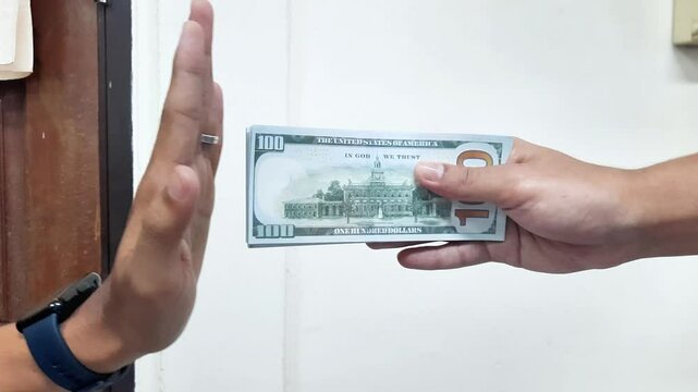 Businessman refusing money - anti bribery and corruption concepts,Business corruption concept