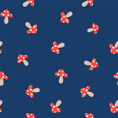 Seamless vector repeat pattern tile with tossed ditsy red mushrooms on navy blue background. Simple fly agaric, amanita muscari shroom toss print