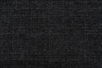 Texture of dense black fabric for tailoring. Canvas. Textile