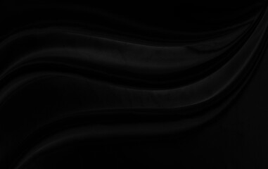 Black gray satin dark fabric texture luxurious shiny that is abstract silk cloth background with patterns soft waves blur beautiful.