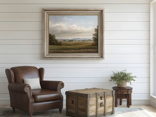 Fototapeta premium Rustic farmhouse living room with white shiplap walls leather armchair wooden trunk coffee table and ornate wooden frame mockup with landscape painting bathed in natural daylight from large windows