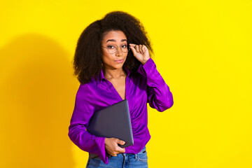 Photo portrait of pretty young girl look skeptical hold netbook wear trendy violet outfit isolated...