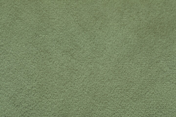 Sage color fabric as background, closeup view
