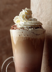Milk coffee cocktail with whipped cream.