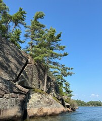 Pointe au Baril Day Granite island cliffs with pine trees in Georgian Bay Ontario Canada