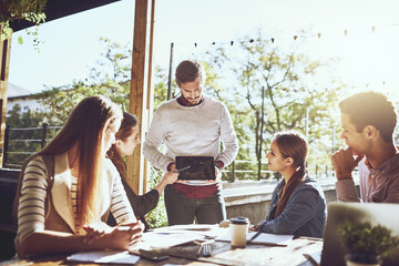 Group, business people and presentation at cafe with tablet for discussion or remote work ideas on...