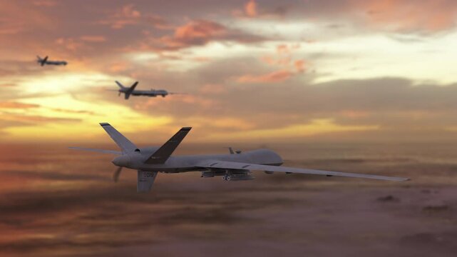 Unmanned military drones fly in the sky. Close up on unmanned fighter drones flying above the clouds during sunset.