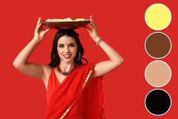 Beautiful young Indian woman holding plate with candles and flowers on red background. Different color patterns