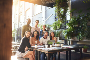 Cafe, business people and portrait with laptop for startup, research and teamwork with smile. Creative agency, social media staff and ideas in restaurant for content creation, website and digital