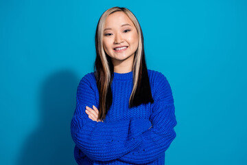Fototapeta premium Portrait photo of dyed hair young vietnamese girl folded hands satisfied smiling seems confident isolated on blue color background