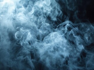 Abstract white smoke or fog flowing in the air against a black background.