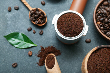 Portafilter with coffee powder on dark background