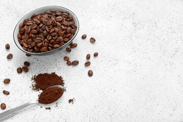 Bowl with coffee beans on light background