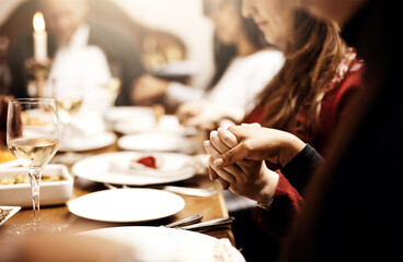 Family, holding hands and prayer for thanksgiving dinner, celebration or holiday. People, gratitude...