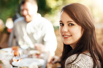 Portrait, girl and thanksgiving for party outdoor with friends, family and holiday celebration of traditional reunion. Smile, woman and relax for brunch event, social hosting and festive feast