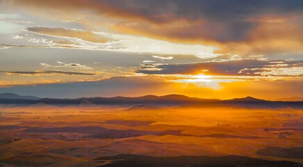 A fall season sunrise over the palouse wheat country in southeastern Washington.