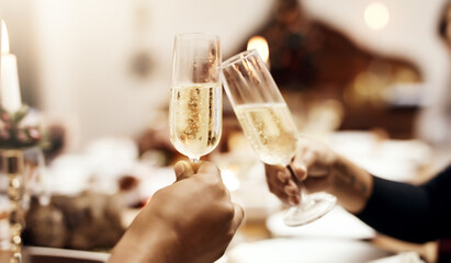 Hands, cheers and glass of champagne for celebration, congratulations and luxury dinner in restaurant. People, toast and sparkling wine for achievement, Christmas and event with solidarity at night