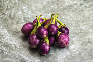 Small organic young purple round eggplant