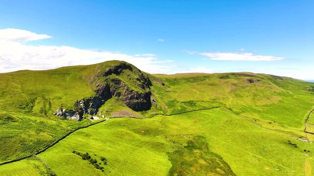 Drone Aerial view of the Beautiful Rolling hills of the coast of Ireland