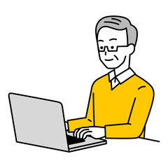 ノートパソコンで仕事をしている年配の男性