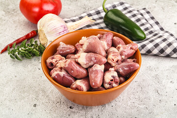 Fresh raw chicken hearts in the bowl
