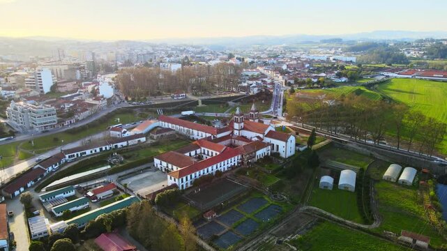 Stunning 4k drone footage of a Portugal city - Santo Tirso. View of the Abade Pedrosa Municipal Museum and the Monastery of St. Benedict (Sao Bento) with the Ave River.