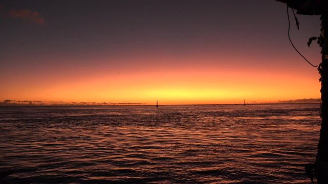 Dark sunset over ocean in French Polynesia